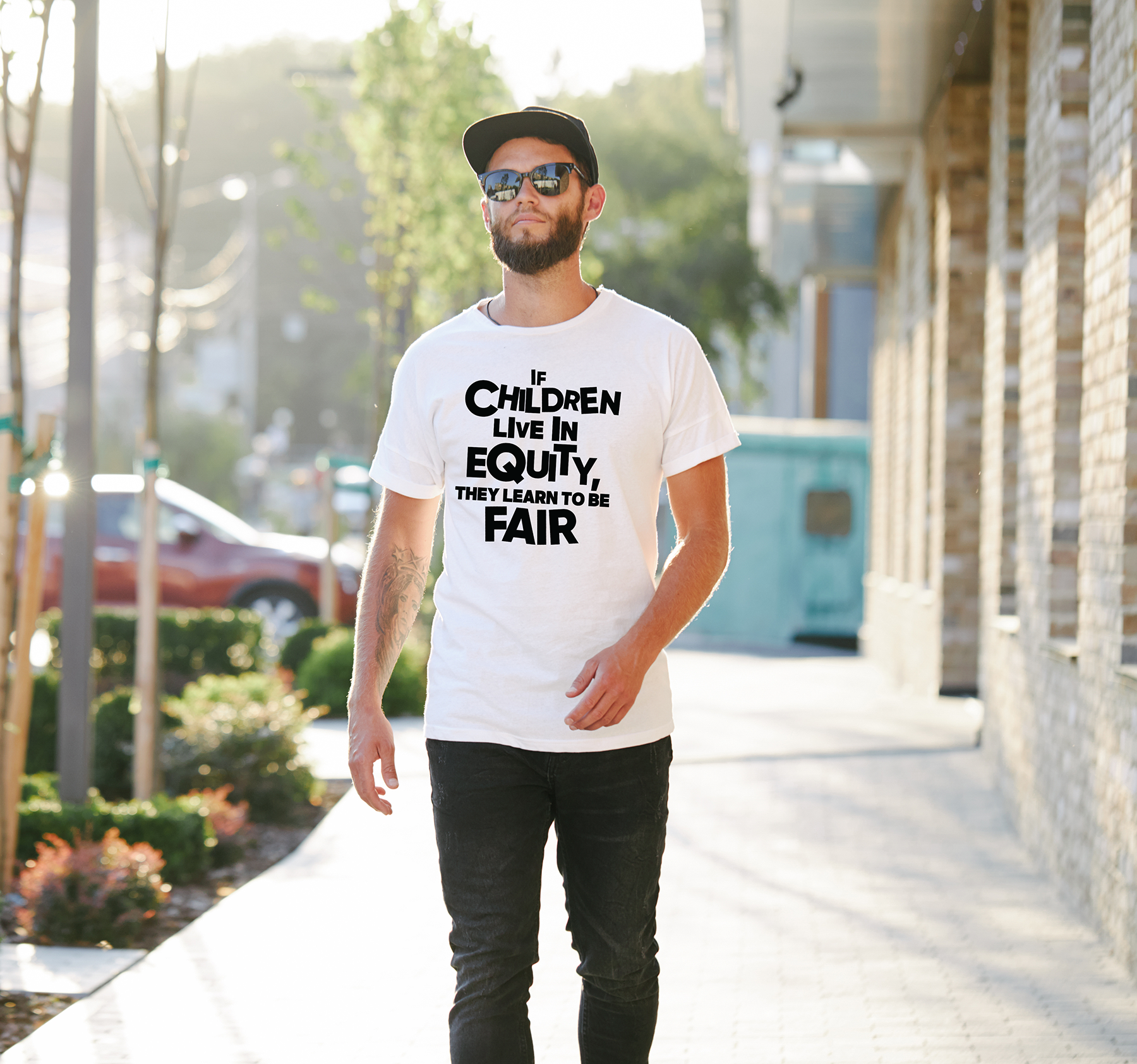 “If children live with equity, they learn to be fair.” – White  (Bella+Canvas) T-shirt